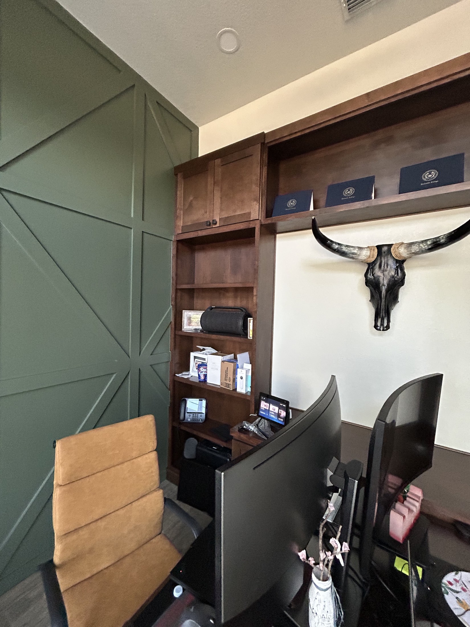 Home office with wood built-in desk and shelving