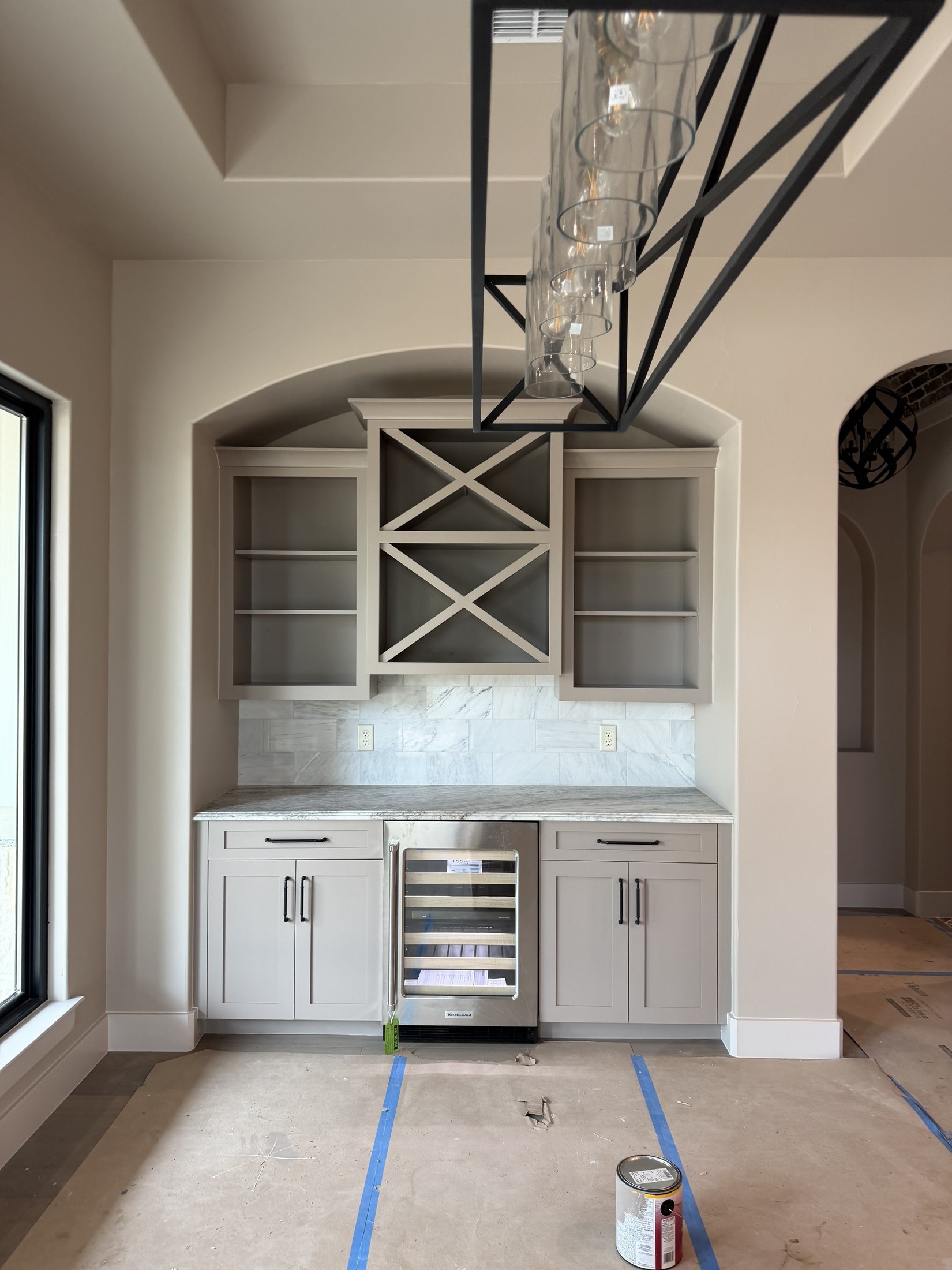 Butler's pantry with wine storage and glass-front cabinets